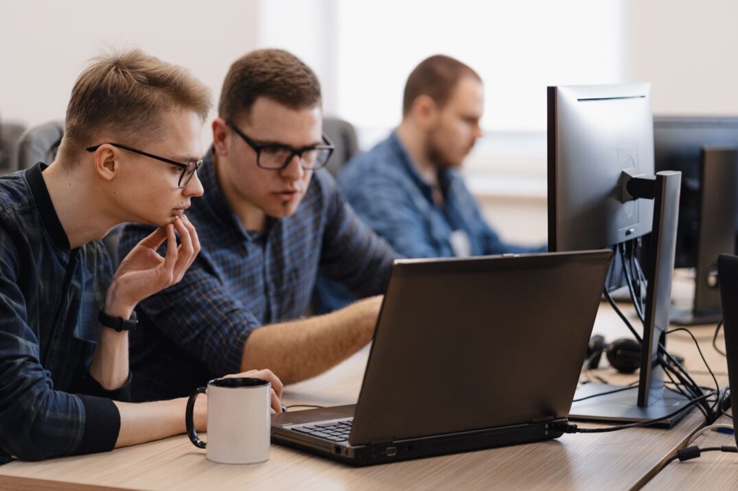 Two men are discussing work