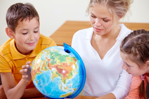 The teacher shows the globe to the students